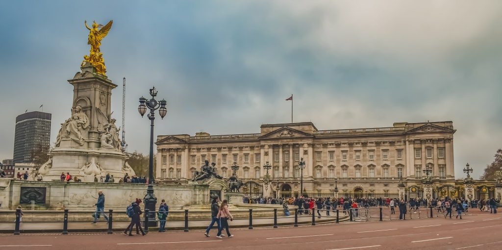 Buckingham Palace attracting a big crowd of tourists on a sunny and cloudy day
